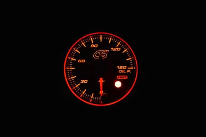 Orange face Mazdaspeed oil pressure gauge.