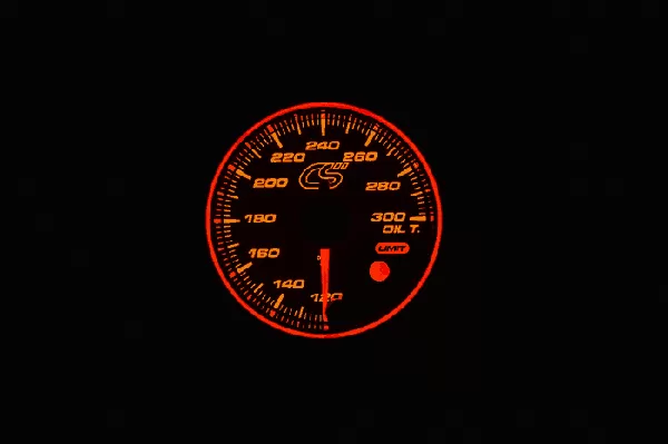 Orange face Mazdaspeed oil temperature gauge.
