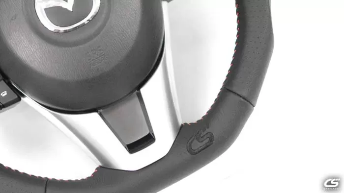 The Leather Mazda 3 Performance Steering Wheel uses high quality genuine leather to upgrade the look of you interior.
