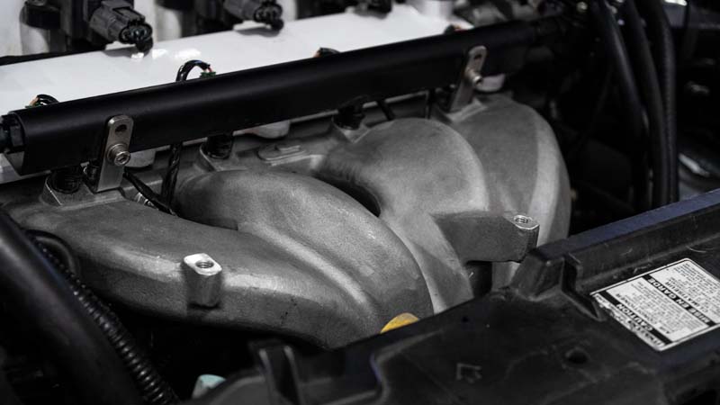 The intake manifold is manufactured from A356-T6 aluminum and post machined for OE fitment.