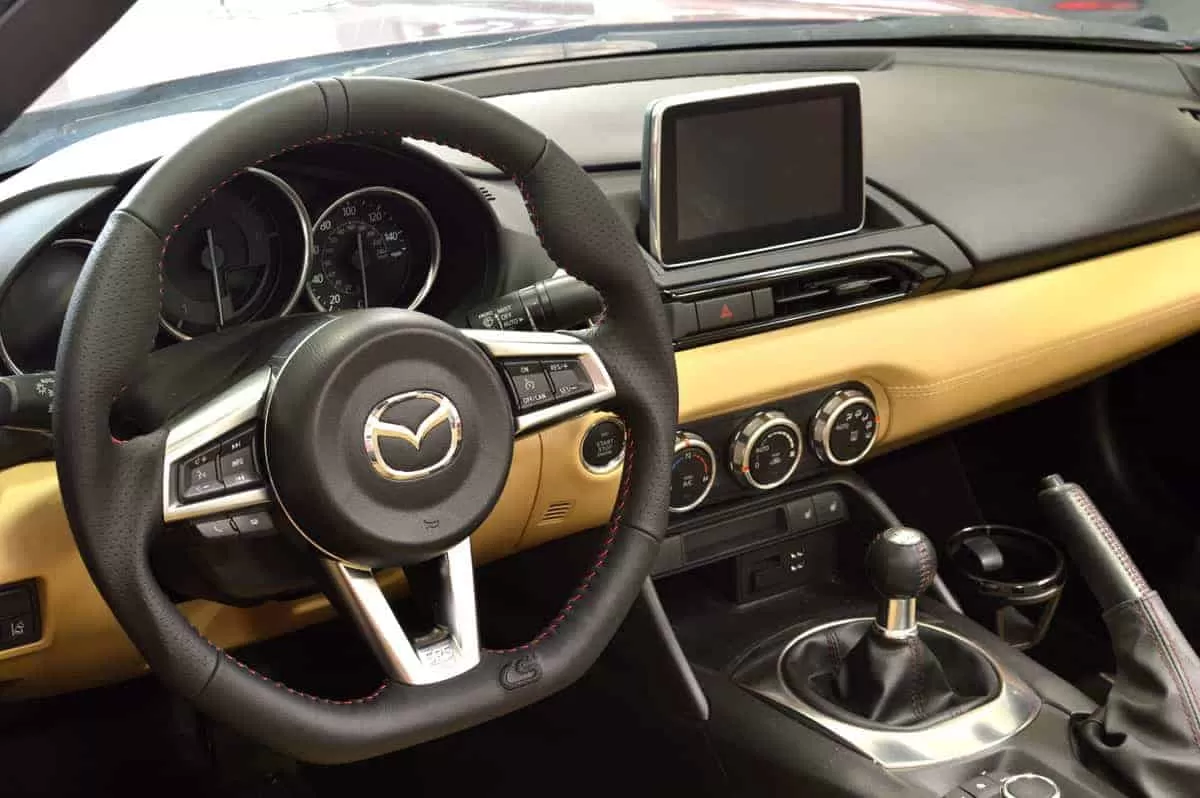 All OEM buttons and trim fit perfectly in the CorkSport Steering Wheel for the Miata.