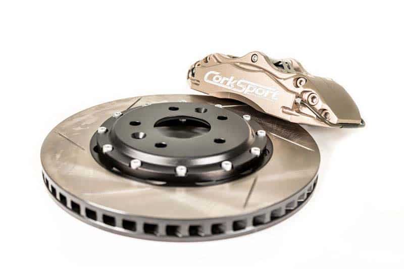 The billet caliper bracket holds the 4-piston calipers stable under hard braking conditions.
