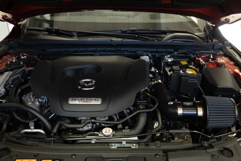 The all black kit is sleek in the Mazda 3 engine bay
