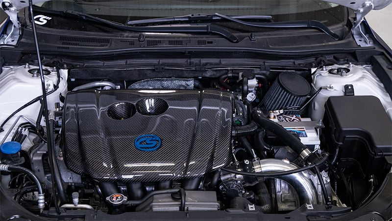 Both the woven carbon and forged carbon offer a great look for your Skyactiv engine