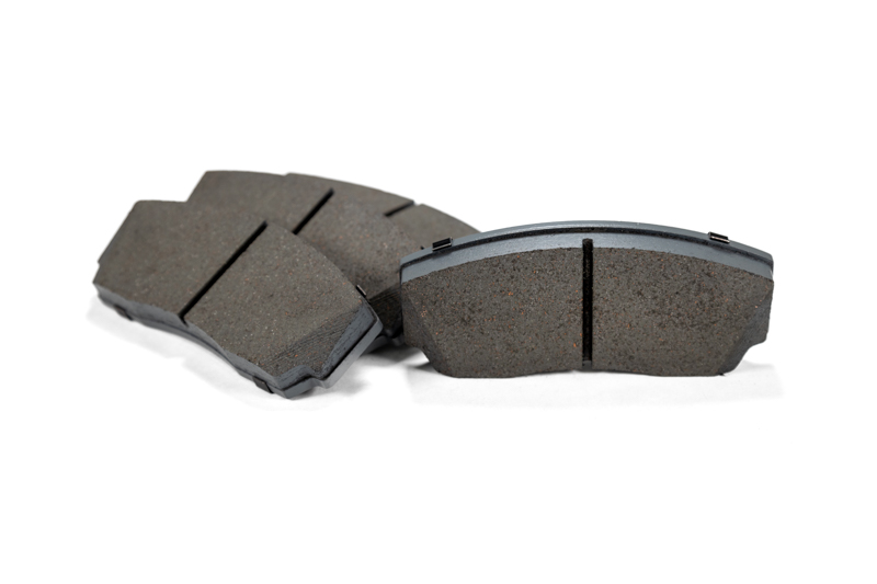 Set of 4 mazda performance brake pads which include the backer.