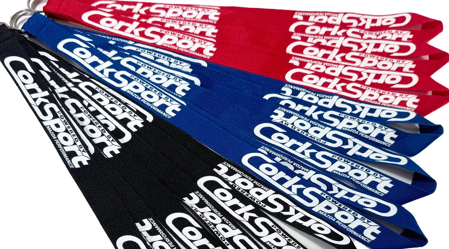 CorkSport Lanyards in Black, Blue, and Red.