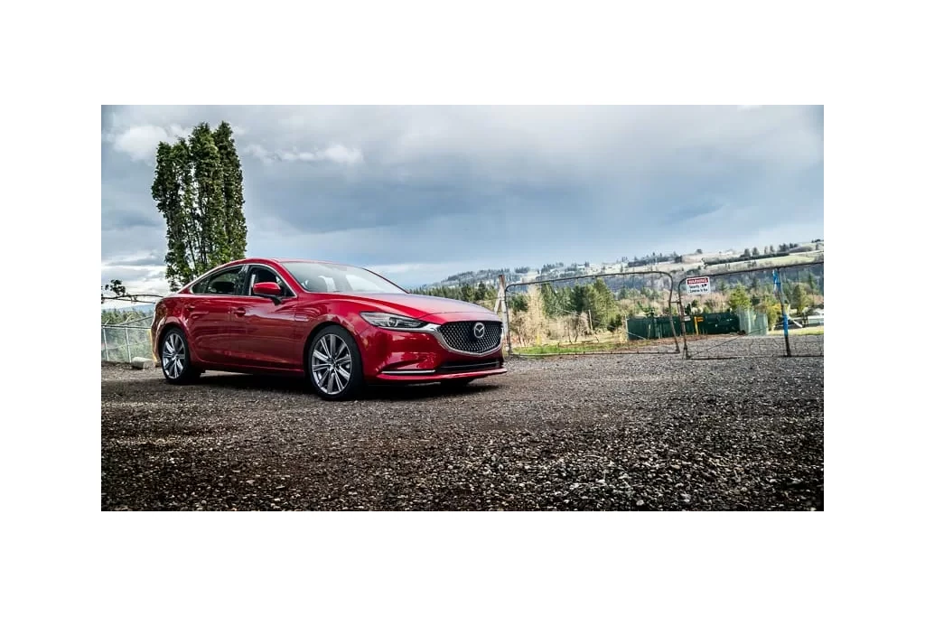 Mazda 6 Shwoing lowering springs. A conservative drop of 1 inch lower in the front and 0.75 inches lower in the rear.