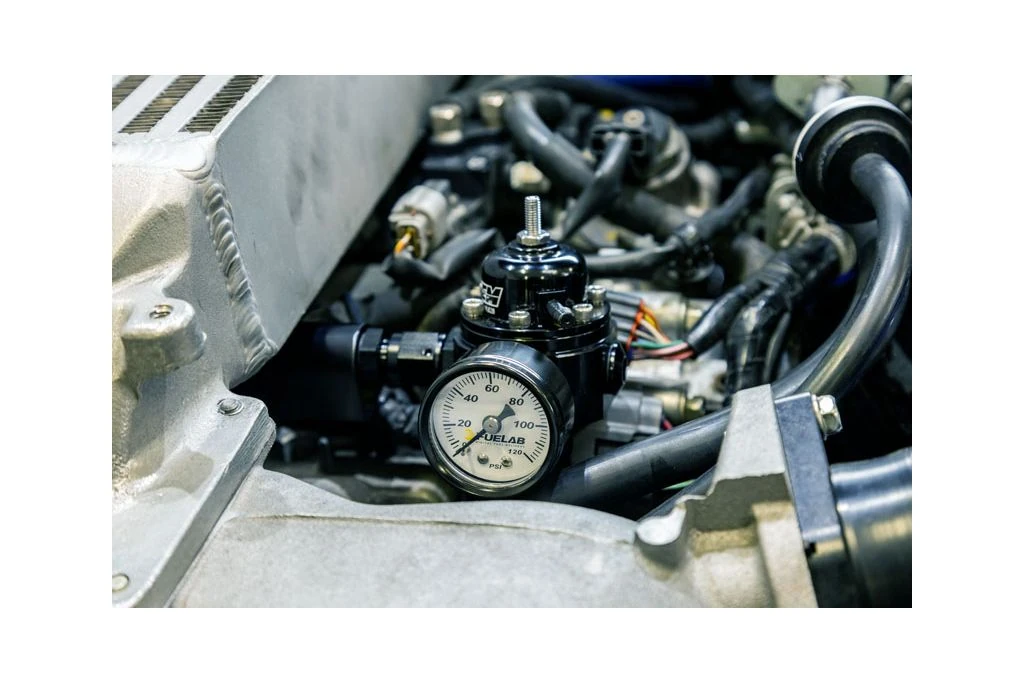 Return style fuel system increases fuel pressure with boost pressure to maintain a consistent fuel supply.