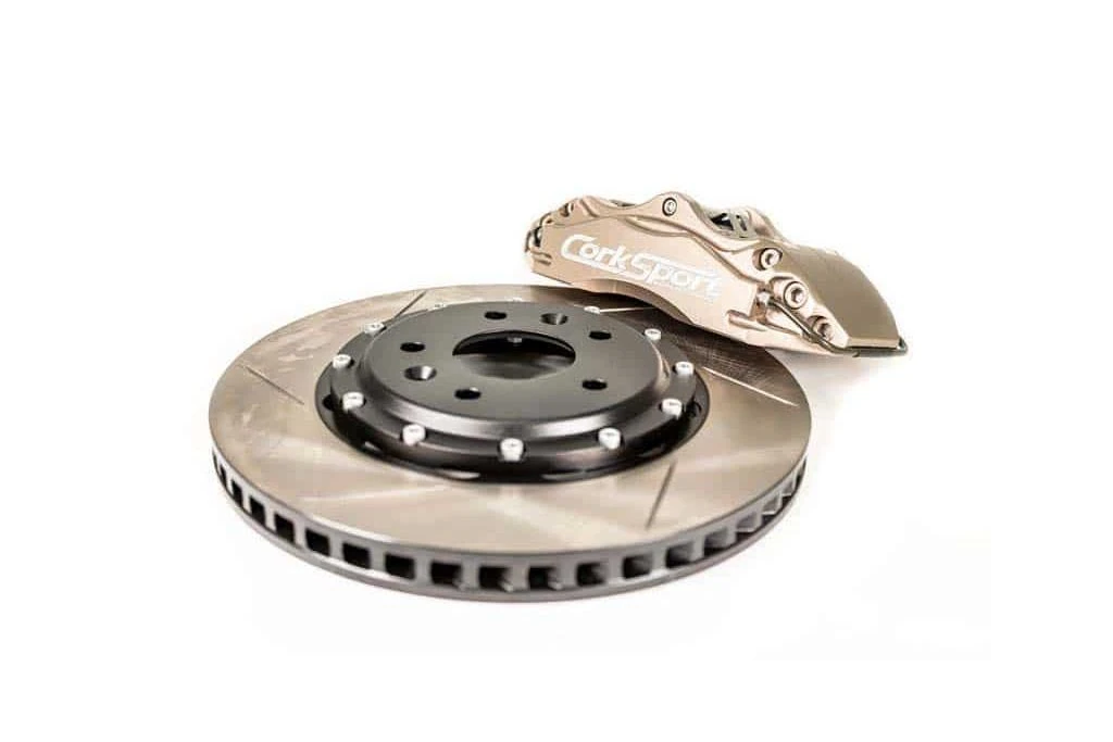 The billet caliper bracket holds the 4-piston calipers stable under hard braking conditions.