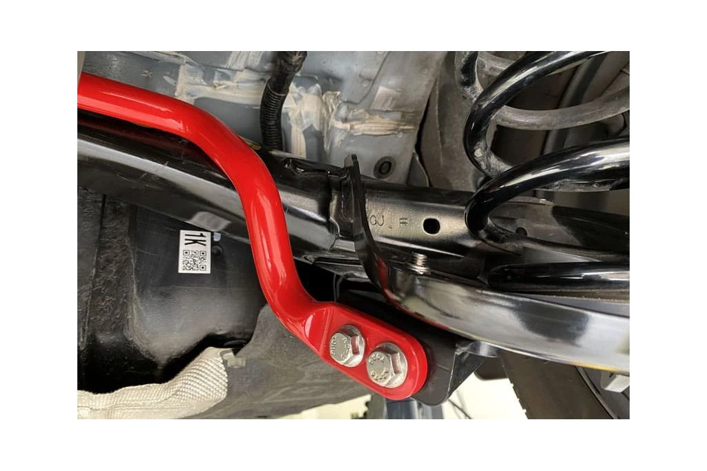 Close up of red sway bar installed on AWD Mazda