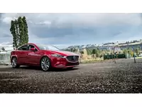 Mazda 6 Shwoing lowering springs. A conservative drop of 1 inch lower in the front and 0.75 inches lower in the rear.