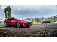 Mazda 6 Shwoing lowering springs. A conservative drop of 1 inch lower in the front and 0.75 inches lower in the rear.