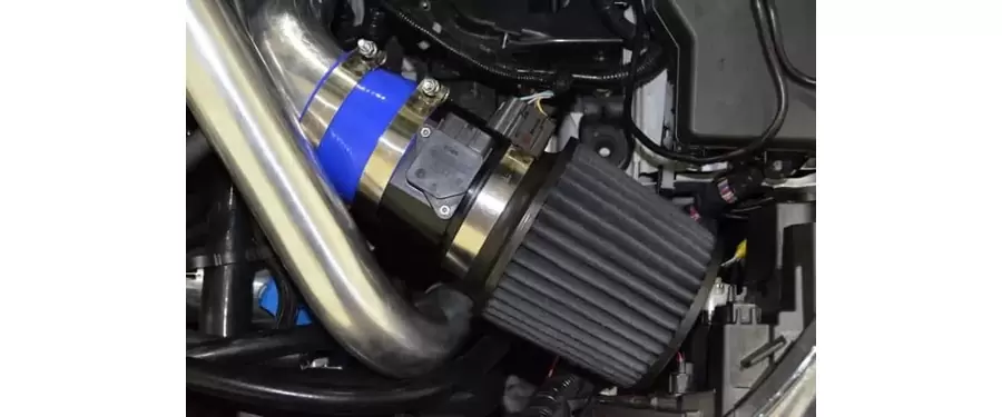 A close up view of the 3.5" intake system in the engine bay of a 2010-2013 Mazdaspeed 3.