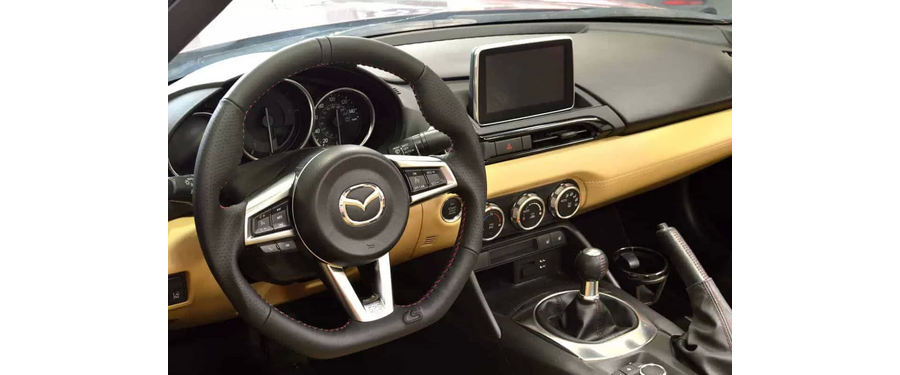All OEM buttons and trim fit perfectly in the CorkSport Steering Wheel for the Miata.