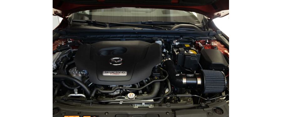 The all black shirt ram kit is sleek in the Mazda 3 engine bay