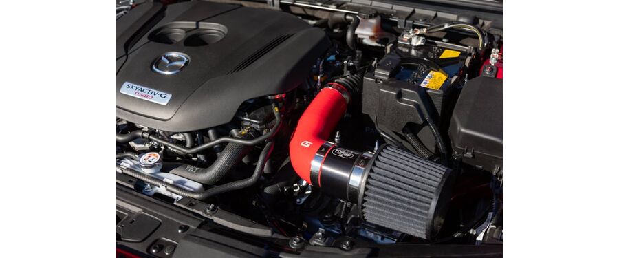 Red short ram intake in engine bay. Clean and simple install for power and turbo noises