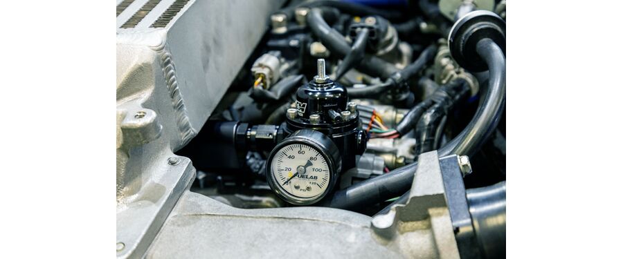 Return style fuel system increases fuel pressure with boost pressure to maintain a consistent fuel supply.