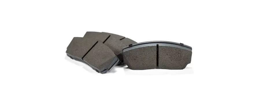 Set of 4 mazda performance brake pads which include the backer.